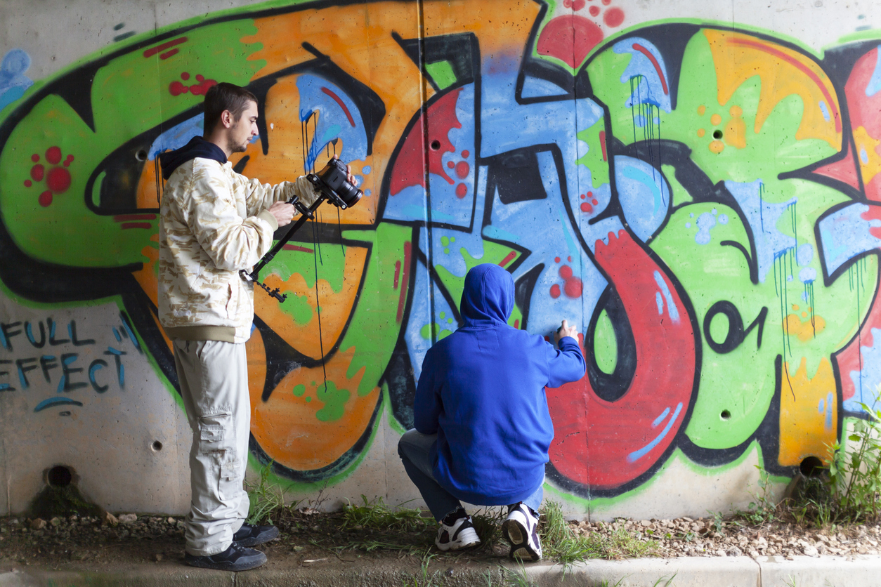 Tutor and young people working on a project