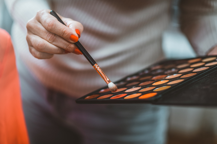 Makeup artist loading brush